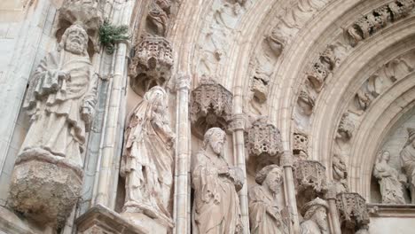Apostles-Sculptures,-Archivolt-And-Tympanum-At-The-Entrance-Of-Santa-Maria-Basilica-In-Castello-d'Empuries-in-Girona,-Catalonia,-Spain