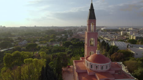 pull-back-reveal-beautiful-church-surrounded-by-trees---drone-shot