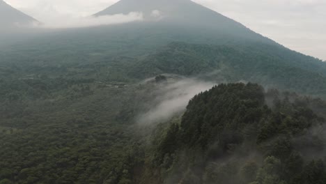 Misty-Landscape-With-Lush-Green-Vegetation-On-Guatemalan-Highlands---aerial-drone-shot