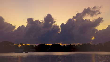 Golden-Pre-Dawn-Sky-And-Clouds-Over-South-Florida-Inlet