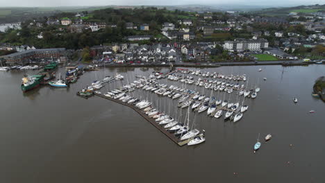 Kinsale-Harbor,-Ireland,-Aerial-View-of-Moored-Boats-and-Waterfront-on-Moody-Day