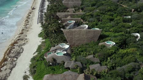 Aerial-top-down-orbiting-over-Papaya-Playa-Project-luxury-resort,-Tulum