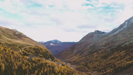 Drone-flight-over-a-stunning-Autumn-alpine-valley