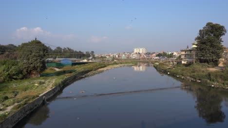 A-view-of-the-Bagmati-River-in-Kathmandu,-Nepal-and-all-the-pollution-in-and-along-its-banks