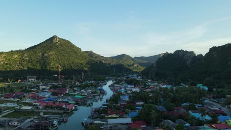 Aerial-footage-on-the-right-side-of-the-river-revealing-the-fishing-village-and-a-super-lovely-landscape