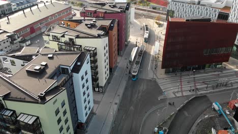 Modern-buildings-of-Gothenburg-old-town-and-tramway-transport,-aerial-drone-view