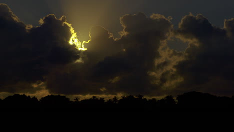 Morning-Sun-Beginning-To-Emerge-From-Behind-Dark-Clouds-In-South-Florida,-U