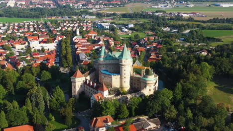 Cinematic-rising-and-revealing-drone-shot-of-Castle-Of-Spirits-or-Bojnice-Castle-in-Slovakia