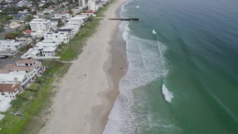 Foamy-Ocean-Waves-On-The-Sandy-Shore-Of-Palm-Beach-In-Gold-Coast,-Queensland,-Australia---aerial-drone-shot