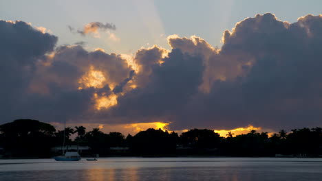 Pastel-Colored-Sunrays-Over-Moored-Boat-In-Inlet-In-South-Florida,-U