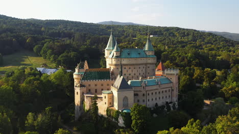 Rotating-drone-shot-of-Castle-Of-Spirits-or-Bojnice-Castle-in-Slovakia