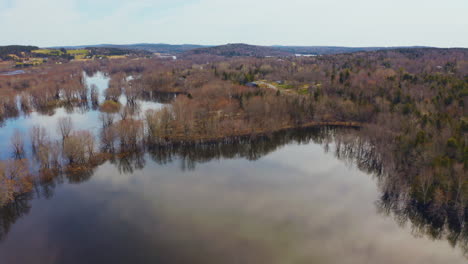 Aerial-view-flying-over-a-flooded-river-that-has-overflowed-after-the-spring-melt