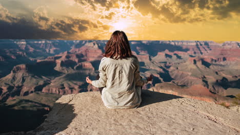 Woman-sitting-on-top-of-hill-in-desert,-mountains,-landscape,-skyline,-sunset,-timelapse-sky-replacement-effect,-panoramic-view,-travel,-tourism,-relaxation,-meditating,-spiritual,-solitude
