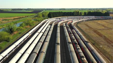 Aerial-view-of-trains-and-locomotives-in-the-storage-sidings-at-Ely,-Cambridgeshire,-UK