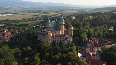 Rotating-drone-shot-of-Bojnice-Castle,-Castle-Of-Spirits,-in-Slovakia