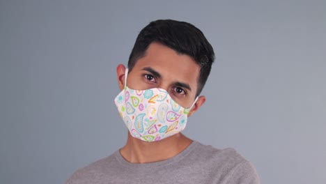 Handsome-hispanic-model-wearing-a-homemade-face-mask-at-the-covid-pandemic