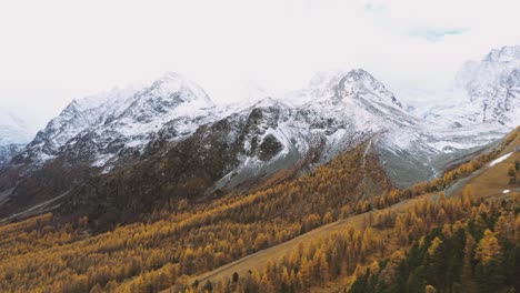 Drone-flight-over-a-stunning-Autumn-alpine-valley