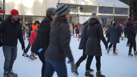 People-Having-Fun-On-Ice-Skating-Rink-At-Bryant-Park-In-New-York-City,-USA