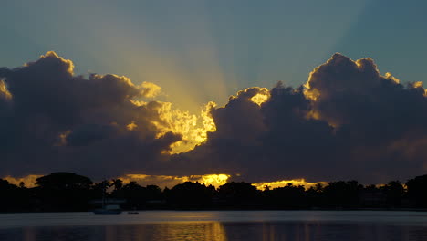 Dramatic-Morning-Sunrise-Over-Still-Water-In-South-Florida-Inlet