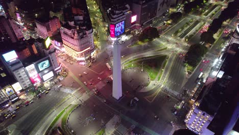 Aerial-orbit-of-the-Buenos-Aires-Obelisk-on-the-widest-avenue-in-the-world,-9-de-Julio