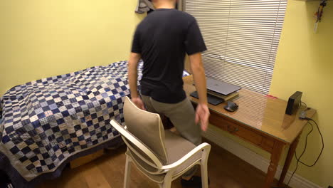 Man-Working-From-Home-In-Front-Of-Laptop-Stand-Up-And-Leave-The-Room