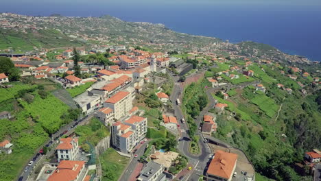 Aerial-moving-over-community-on-hillside-of-Madeira-Portugal-in-midday