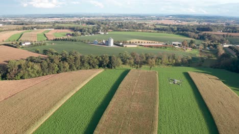 Aerial-of-drone-flying-in-mid-air-above-farm-fields
