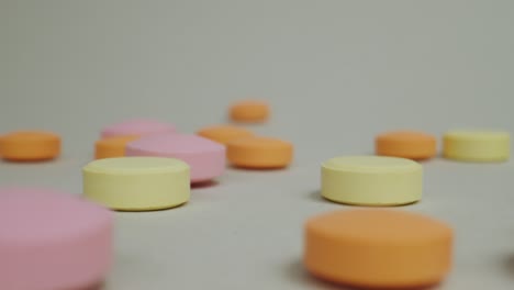 close-up-dolly-in-shot-of-disk-shaped-covid19-antiviral-tablet-pills