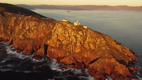 Aerial-view-of-Cape-Finisterre-The-end-of-the-earth-Galicia-north-of-Spain-tourist-attraction,-lighthouse-top-of-rock-cliff-formation