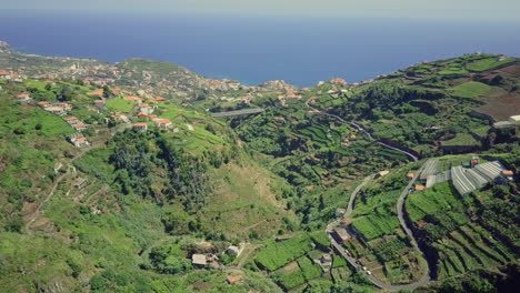 Aerial-panning-up-from-valley-overlooking-Atlantic-Ocean-on-Madeira-Portugal