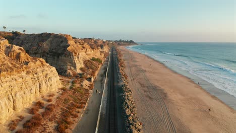 Aerial-view-of-an-Amtrak-train-passing-under-in-San-Clemente-California