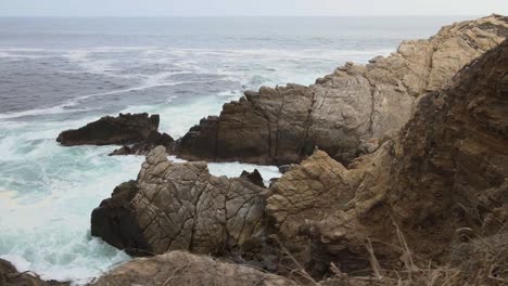 Walking-side-to-cliff-and-big-waves-in-Punta-Cometa,-most-east-site-in-Mexico