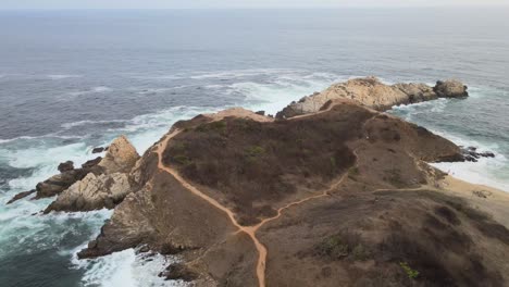 Pull-back-above-Punta-Cometa,-with-view-of-cliffs,-in-Oaxaca,-Mexico