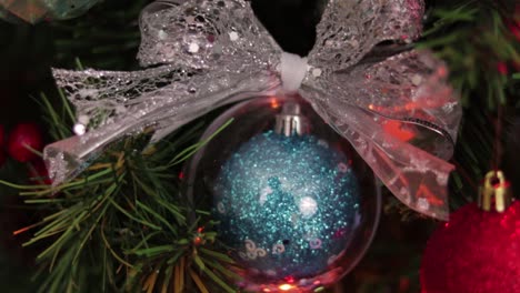 Transparent-christmas-ball-hanging-from-the-christmas-tree