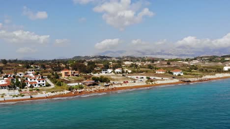 Megas-Lakkos-Beach,-red-sand-shore-near-Lixouri-and-Xi-beach-in-Kefalonia,-Ionian-Islands,-Greece---aerial-drone-shot