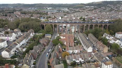 Train-crossing-viaduct-on-Southeastern-line-Folkestone-Kent-UK-Aerial-4k-footage