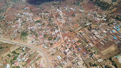 High-aerial-of-a-stunning-Town-in-rural-Kenya,-drone-flying-backwards