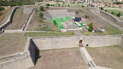Aerial-Pullback-view-chapel-of-Our-Lady-of-Brotas-inside-São-Neutel-Fortress,-Chaves