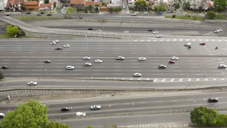 Thousands-of-cars-drive-along-the-great-Pan-American-Highway-next-to-a-neighborhood-in-the-city-of-Buenos-Aires