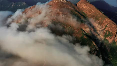 A-time-lapse-video-of-Slow-moving-clouds-moving-along-the-ridge-of-the-Lantau-peak-in-Lantau-island,-the-largest-island-in-Hong-Kong