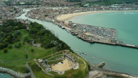 Reveal-Shot-Of-Historic-Nothe-Fort-In-Weymouth,-Dorset,-UK---aerial-pullback