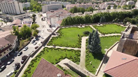 Aerial-circling-view-of-gardens-and-cityscape-from-Menagem-Tower-of-Chaves-castle-in-Portugal