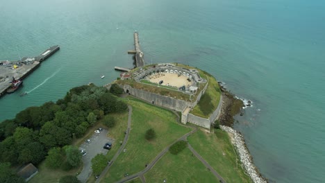 Aerial-View-Of-Weymouth's-Historic-Nothe-Fort-On-The-Jurassic-Coast,-Dorset,-UK---drone-shot