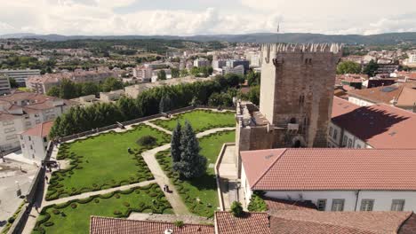 Aerial-view-of-the-Chaves-castle-tower-and-gardens-in-Portugal,-Europe