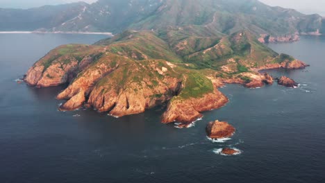 Amazing-Aerial-View-of-the-coastline-and-mountains-near-Bate-Head,-Tai-Long-Wan,-Sai-Kung,-Country-Park-in-the-East-of-Hong-Kong