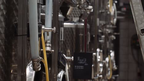 Shallow-focus-tilt-up-shot-of-wine-tanks-used-in-the-wine-making-process