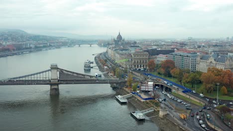 Danube-riverside-aerial-view-with-ships,-Széchenyi-Chain-Bridge-and-buda-castle,-Hungary