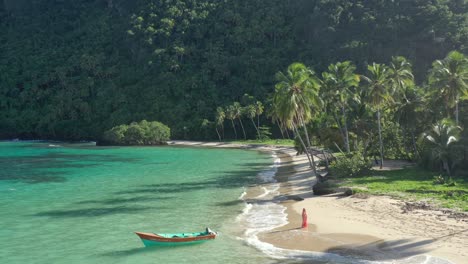One-woman-alone-strolling-on-Hermitano-paradise-beach,-Samana-in-Dominican-Republic