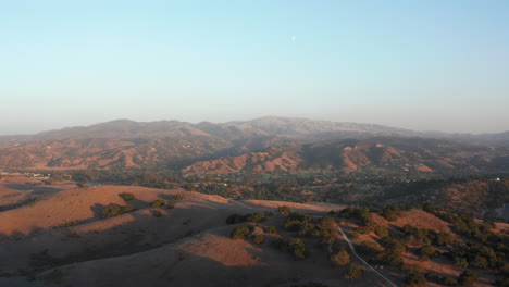 Aerial-View-Of-Northern-California-Hills-Near-The-Town-During-Sunset