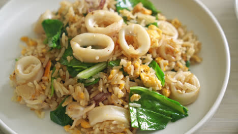 Fried-rice-with-squid-or-octopus-in-bowl---stir-fried-rice-with-squid,-egg-and-kale